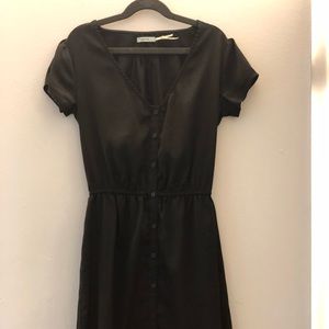Black, shiny material short sleeve button up dress